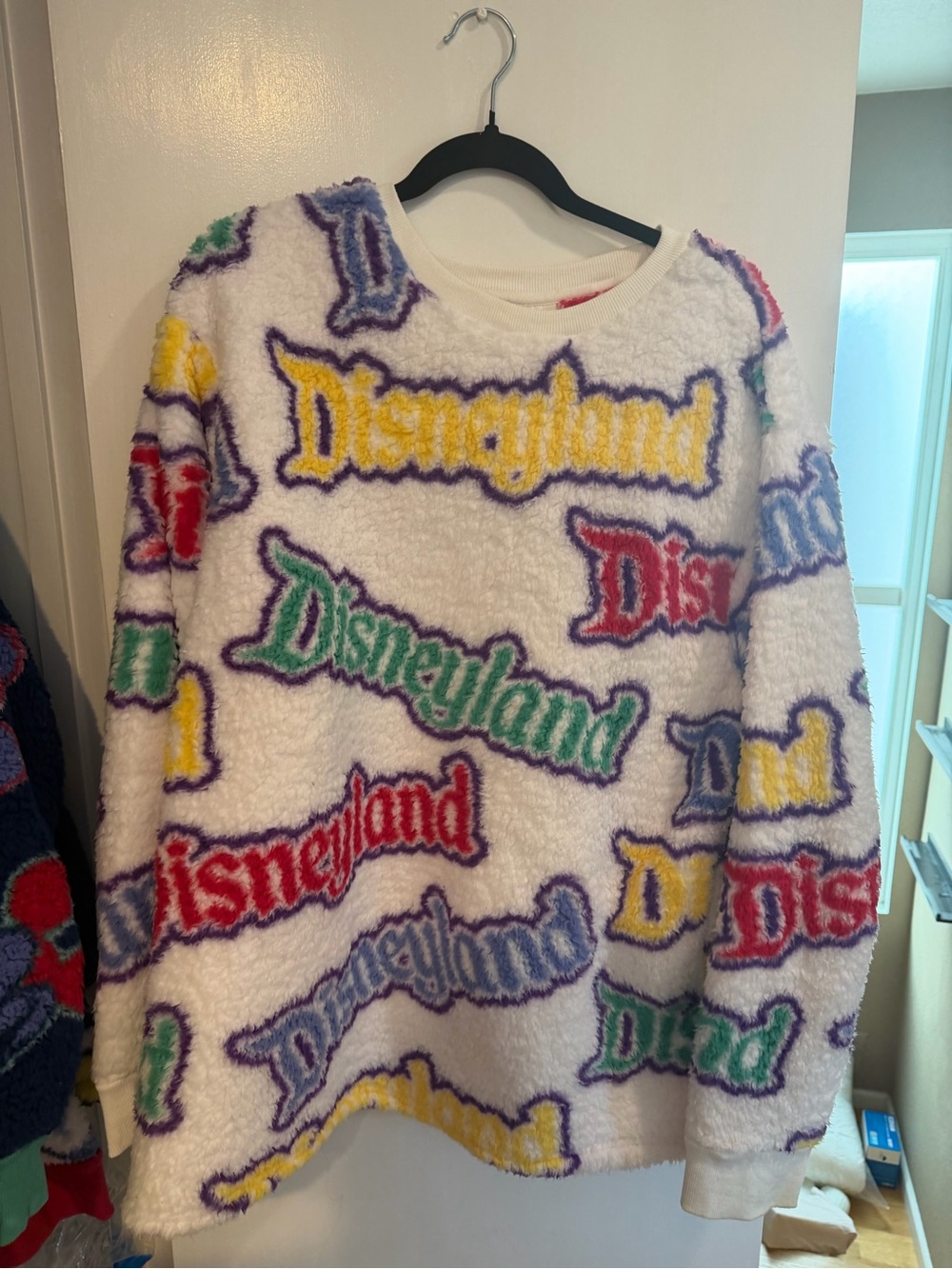 Disney White Sherpa Pullover with Multicolor Disneyland Logos